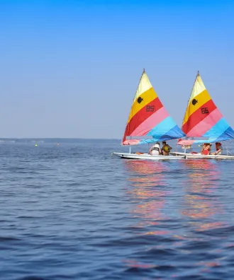 Three sail boats on the water