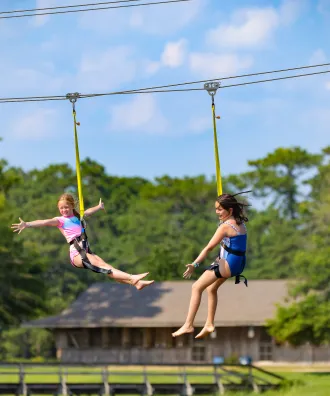 Two girls on the zipline