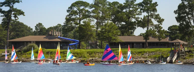 Several sailboats and kayaks near the waterfront