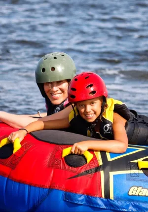 Two kids tubing at family camp