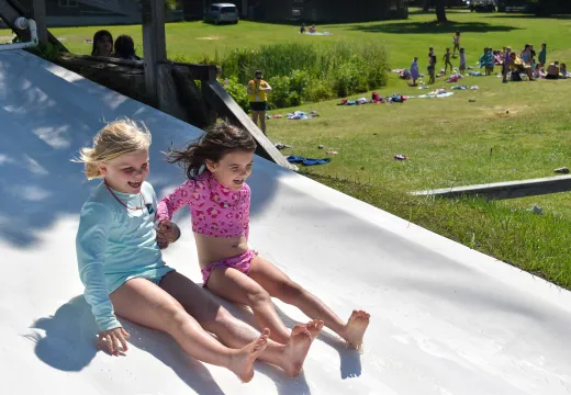 Two girls on the slide at Camp Seafarer